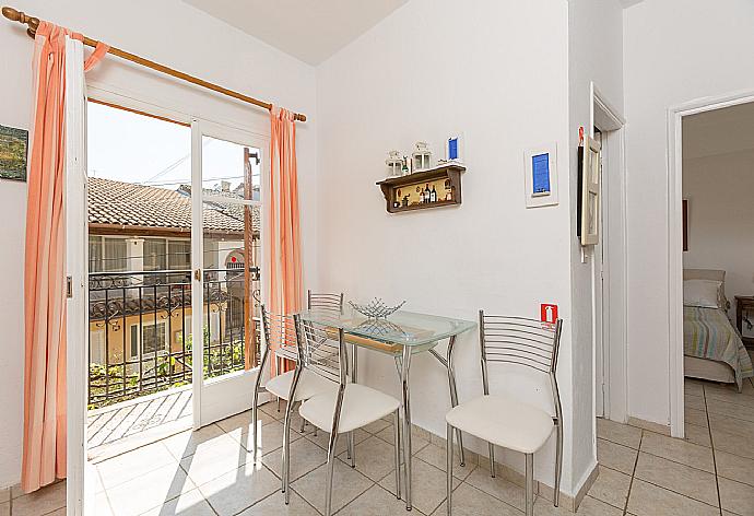 Dining area and balcony access . - Anna Apartment . (Photo Gallery) }}