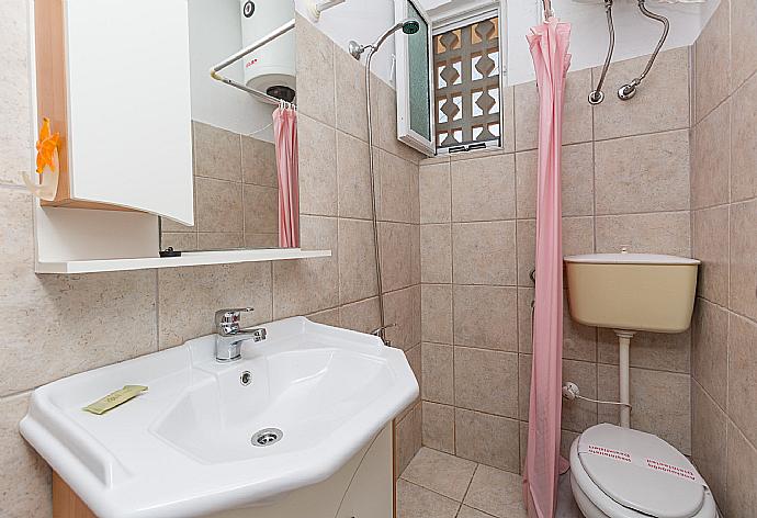 Bathroom with shower . - Anna Apartment . (Photo Gallery) }}