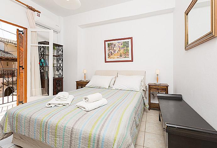 Double bedroom with A/C and balcony access . - Anna Apartment . (Photo Gallery) }}