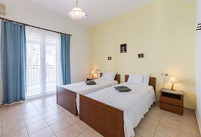 Twin bedroom with A/C and balcony access . - Villa Armandos . (Photo Gallery) }}