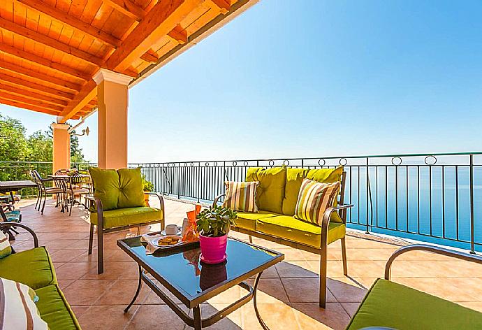 Balcony on first floor with outdoor seating and panoramic views . - Villa Armandos . (Galerie de photos) }}