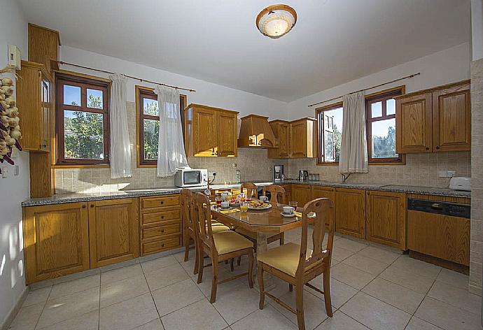 Equipped kitchen and dining area . - Villa Ariadne . (Photo Gallery) }}