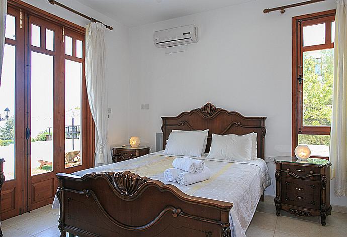 Double bedroom with A/C and terrace access . - Villa Ariadne . (Photo Gallery) }}