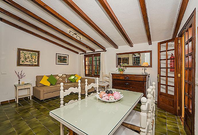 Living room with sofas, dining area, ornamental fireplace, WiFi internet, satellite TV, DVD player, and terrace access . - Villa Ciutada . (Photo Gallery) }}