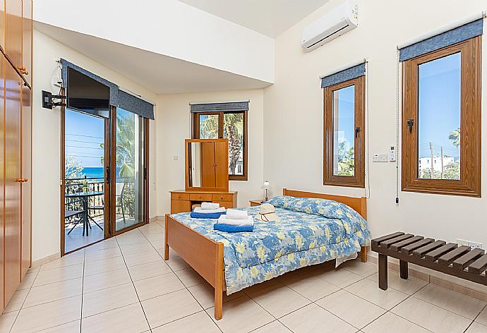 Double bedroom with en suite bathroom, A/C, sea views, and balcony access . - Villa Halima Georgios . (Photo Gallery) }}