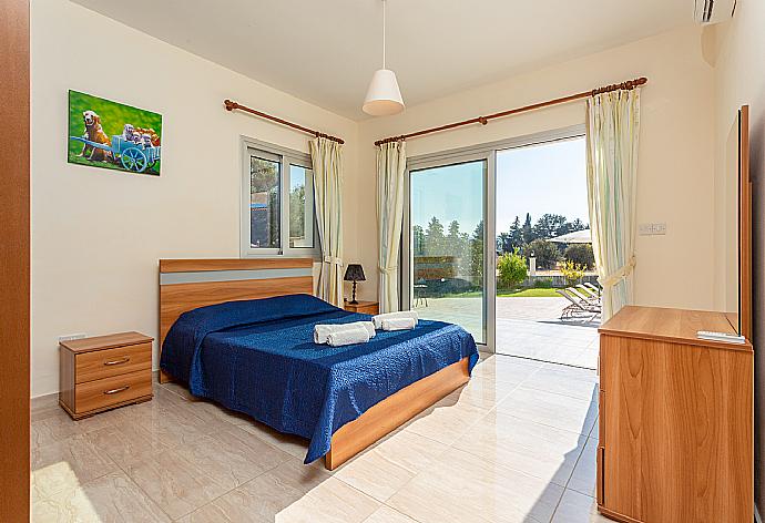 Double bedroom with en suite bathroom, A/C, and pool terrace access . - Villa Achilleas Chrystalla . (Photo Gallery) }}