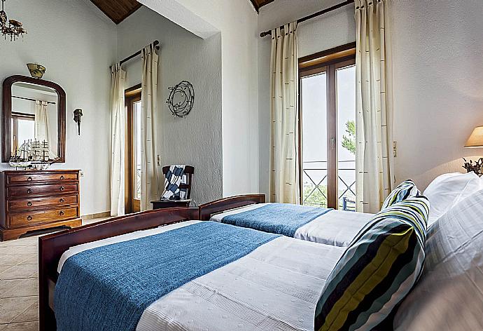 Twin bedroom with A/C and balcony access . - Villa Raches . (Galleria fotografica) }}