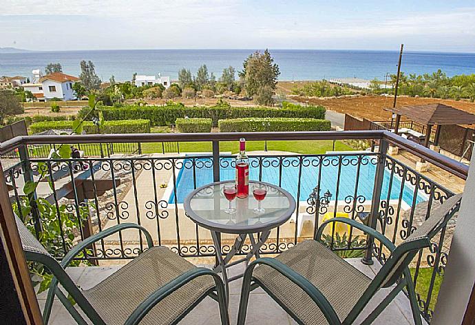 Balcony with pool view  . - Villa Minoas . (Photo Gallery) }}