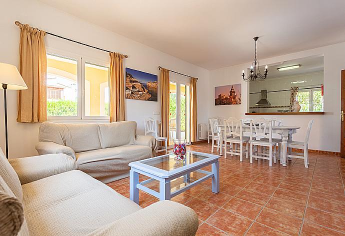 Living room with sofas, dining area, ornamental fireplace, WiFi internet, satellite TV, DVD player, and terrace access . - Villa Paula . (Galerie de photos) }}