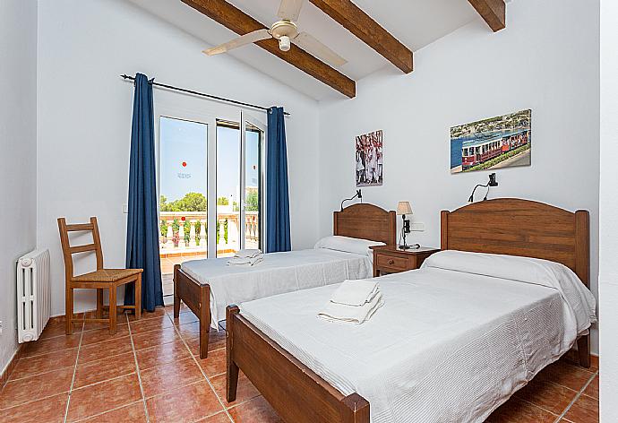 Twin bedroom with balcony access . - Villa Paula . (Photo Gallery) }}