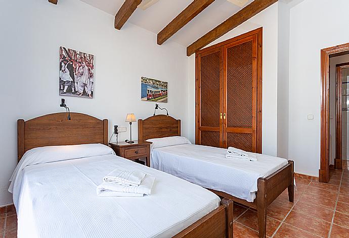 Twin bedroom with balcony access . - Villa Paula . (Photo Gallery) }}