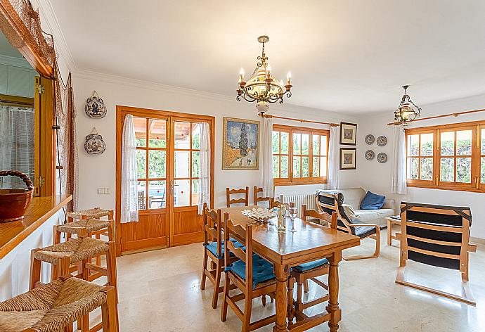 Open-plan living room with sofas, dining area, kitchen, WiFi internet, satellite TV, DVD player, and terrace access . - Villa Isabel . (Galleria fotografica) }}