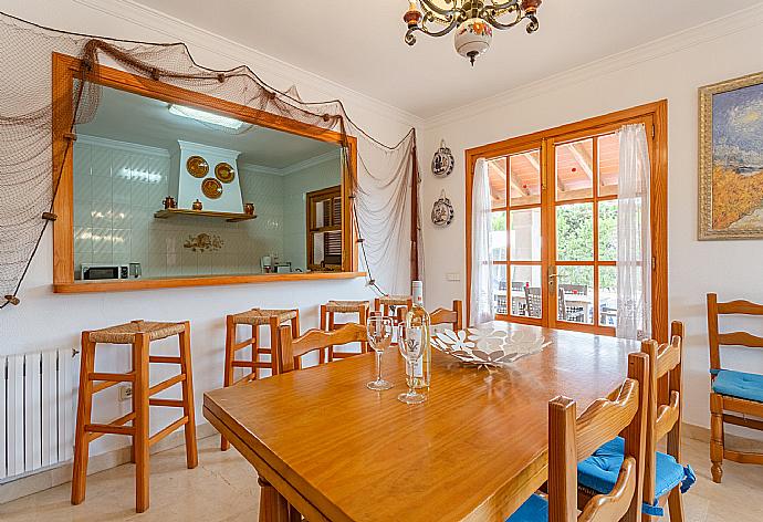 Open-plan living room with sofas, dining area, kitchen, WiFi internet, satellite TV, DVD player, and terrace access . - Villa Isabel . (Galleria fotografica) }}