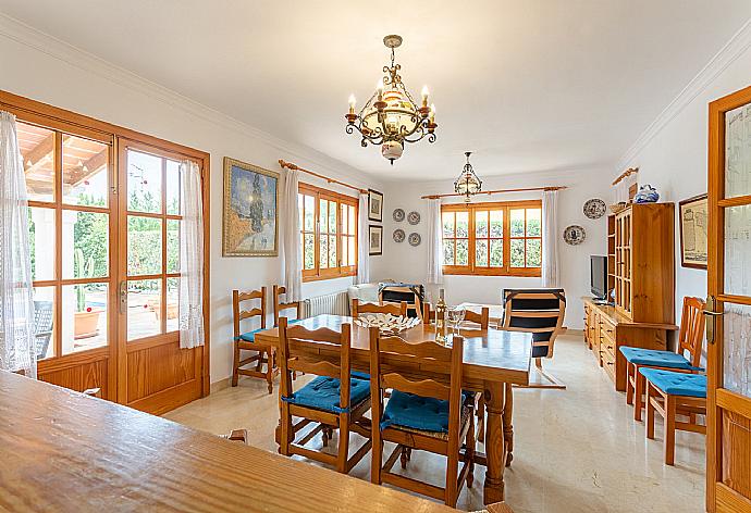 Open-plan living room with sofas, dining area, kitchen, WiFi internet, satellite TV, DVD player, and terrace access . - Villa Isabel . (Galleria fotografica) }}