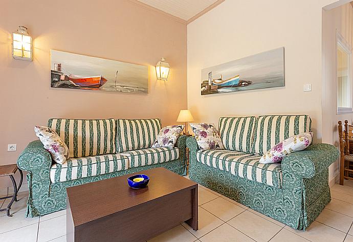 Open-plan living room with dining area, kitchen, A/C, WiFi internet, satellite TV, and balcony access . - Fay Apartment . (Fotogalerie) }}