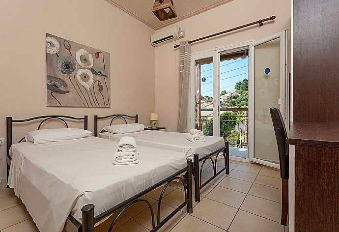 Twin bedroom with A/C and balcony access . - Fay Apartment . (Fotogalerie) }}