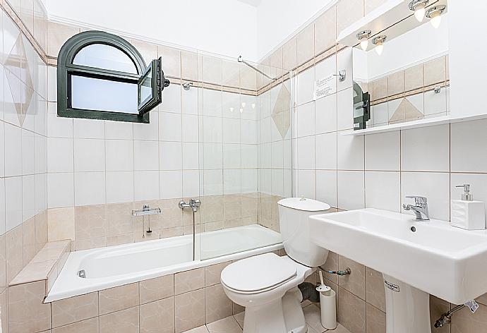 En suite bathroom with bath and shower . - Katerina . (Photo Gallery) }}