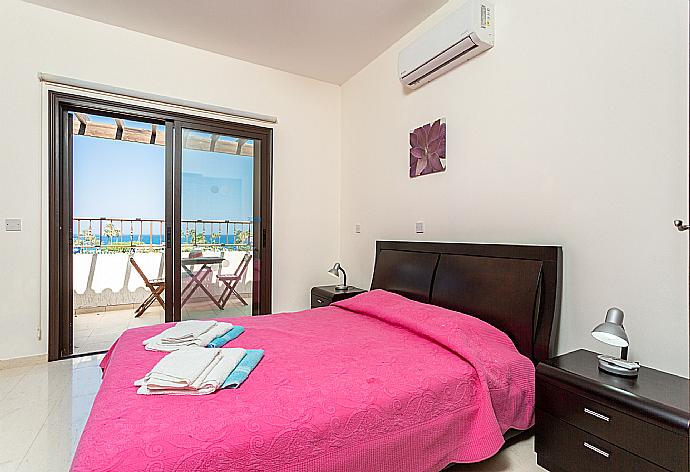 Double bedroom with en suite bathroom, A/C, and upper terrace access with sea views . - Villa Fortuna . (Photo Gallery) }}