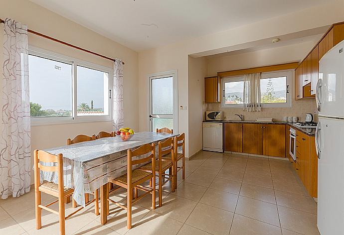 Open-plan living room with sofas, dining area, equipped kitchen, WiFi internet, satellite TV, DVD player, and terrace access . - Villa Regina 1 . (Photo Gallery) }}