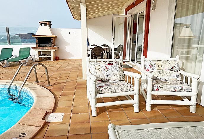 Sheltered patio  with outdoor BBQ . - Villa Remos Ocho . (Photo Gallery) }}