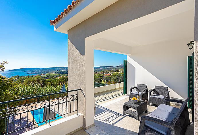 Upper terrace area with sea views . - Villa Erasmia . (Photo Gallery) }}