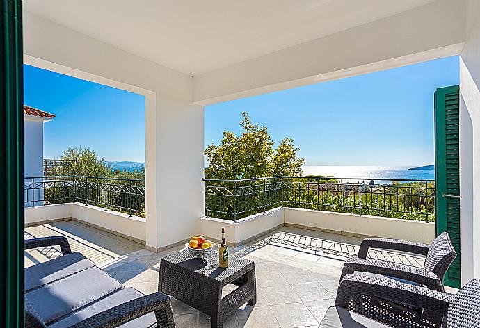 Upper terrace area with sea views . - Villa Erasmia . (Photo Gallery) }}