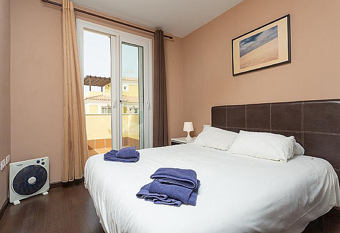Double bedroom with balcony access . - Villa Golden . (Photo Gallery) }}