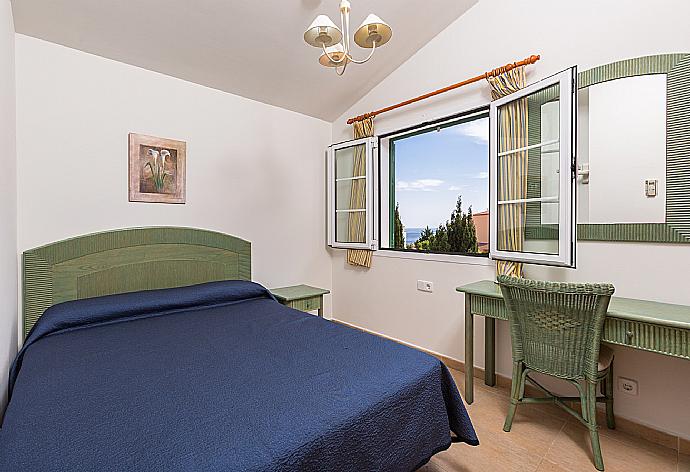 Double bedroom with A/C and sea views . - Villa Cala Galdana 7 . (Photo Gallery) }}