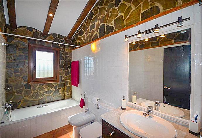 En suite bathroom, bath with shower. W/C. . - Villa Araceli . (Photo Gallery) }}