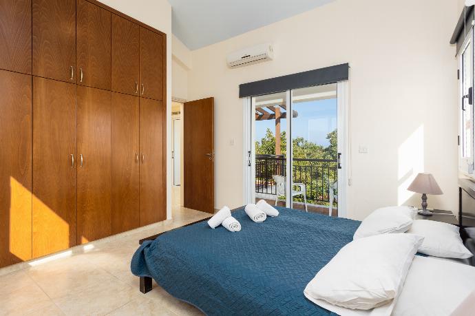 Double bedroom with en suite bathroom, A/C, and balcony access . - Villa Kleopatra . (Photo Gallery) }}