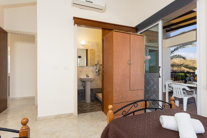 Twin bedroom with en suite bathroom, A/C, and balcony access . - Villa Kleopatra . (Photo Gallery) }}