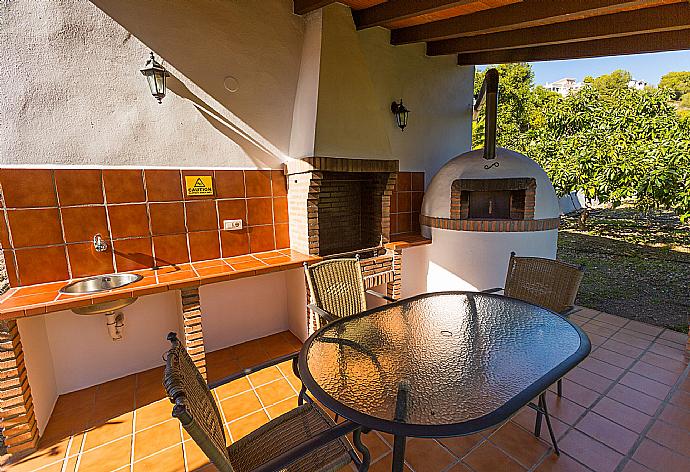 Sheltered terrace area with BBQ . - Villa Tinajas . (Photo Gallery) }}