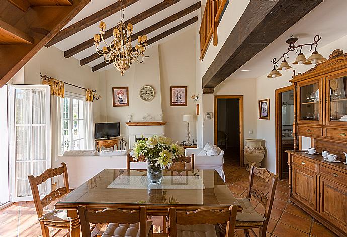 Open-plan living room with sofas, WiFi Internet, Satellite TV, DVD player, dining area and ornamental fire place.  . - Villa Tinajas . (Photo Gallery) }}