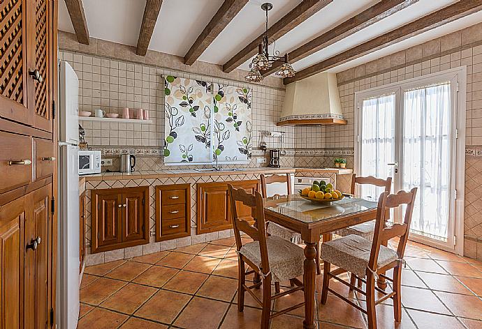 Open-plan living room with sofas, WiFi Internet, Satellite TV, DVD player, dining area and ornamental fire place.  . - Villa Tinajas . (Photo Gallery) }}