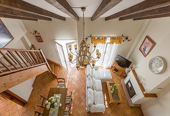Open-plan living room with sofas, WiFi Internet, Satellite TV, DVD player, dining area and ornamental fire place.  . - Villa Tinajas . (Photo Gallery) }}