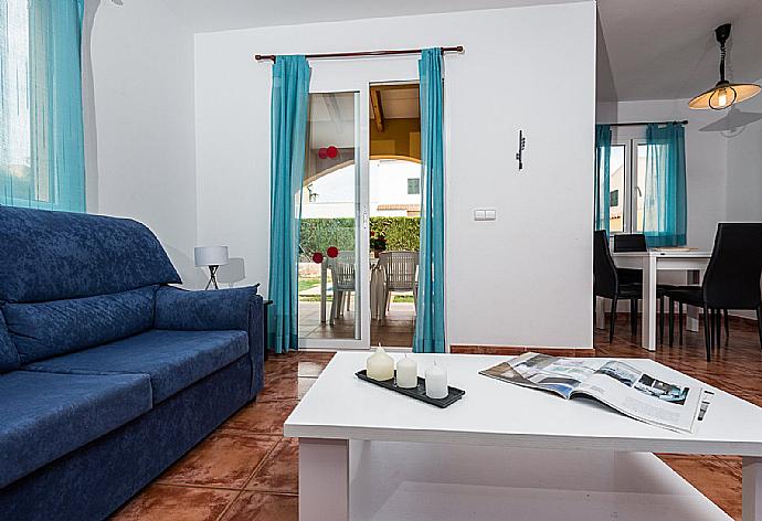 Living room with sofas, WiFi Internet, Satellite TV, DVD player and dining area. . - Villa Tranquila . (Галерея фотографий) }}