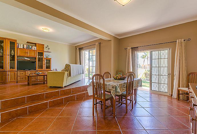 Living room with sofas, dining area, ornamental fireplace, WiFi internet, satellite TV, and DVD player . - Casa Amendoeira . (Photo Gallery) }}