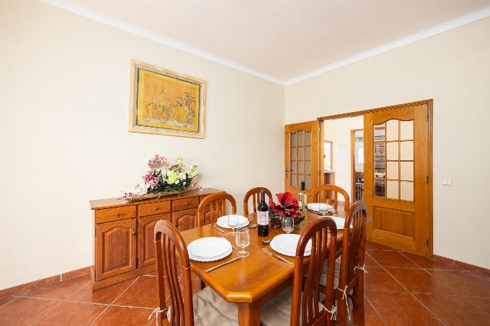 Living room with sofa, dining area, ornamental fireplace, A/C, WiFi internet, and satellite TV . - Villa Amendoeira . (Photo Gallery) }}