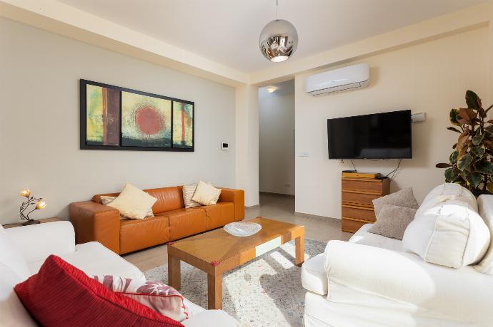 Open-plan living room on ground floor with sofas, dining area, kitchen, A/C, WiFi internet, satellite TV, views, and terrace access . - Villa Christel . (Photo Gallery) }}