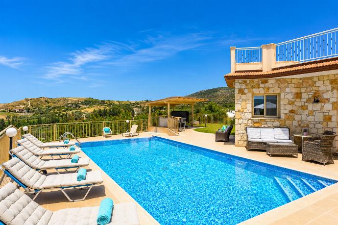 Sunny private pool area with comfortable sun loungers, a stone villa backdrop, and beautiful countryside views. . - Villa Christel . (Photo Gallery) }}