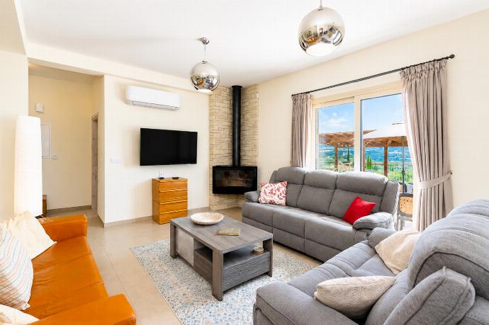 Bright living room with comfortable sofas, modern decor, and lovely views from the terrace. . - Villa Christel . (Photo Gallery) }}