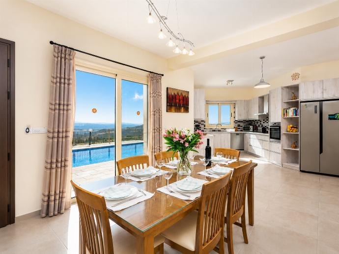 Open-plan living room on ground floor with sofas, dining area, kitchen, A/C, WiFi internet, satellite TV, views, and terrace access . - Villa Christel . (Photo Gallery) }}