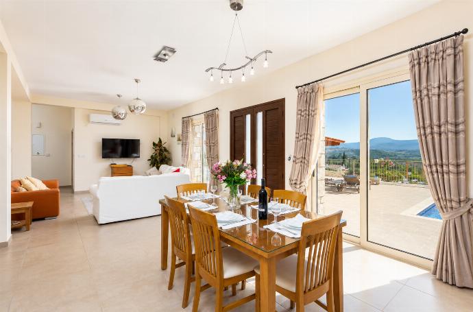Open-plan living room on ground floor with sofas, dining area, kitchen, A/C, WiFi internet, satellite TV, views, and terrace access . - Villa Christel . (Photo Gallery) }}