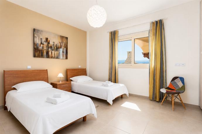 Twin bedroom on ground floor with en suite bathroom and A/C . - Villa Christel . (Photo Gallery) }}
