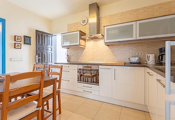 Equipped kitchen and dining area  . - Villa Angela Vista . (Photo Gallery) }}