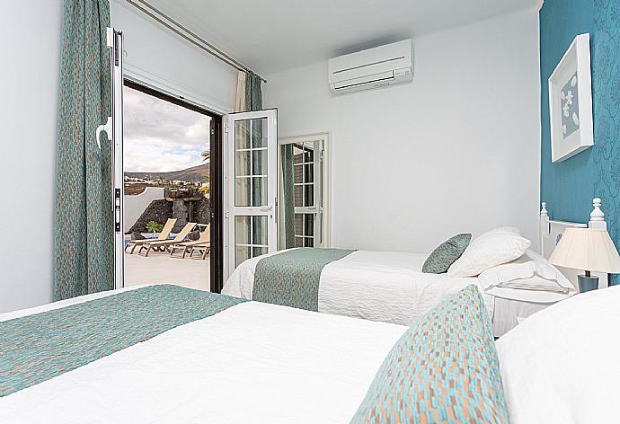 Twin bedroom with A/C and pool terrace access . - Villa Angela Vista . (Photo Gallery) }}