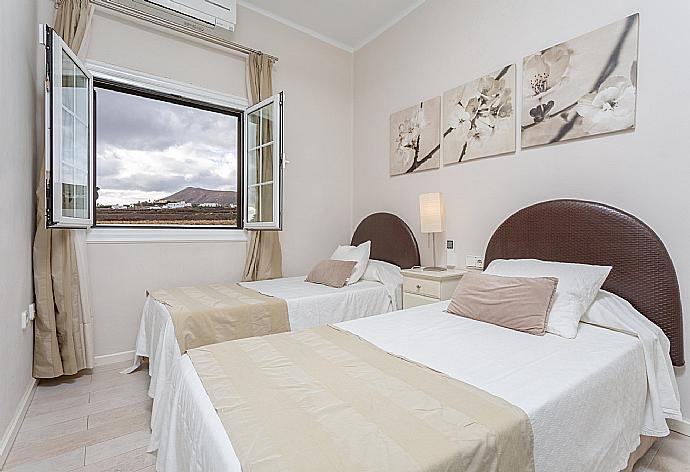 Twin bedroom with A/C . - Villa Angela Vista . (Photo Gallery) }}