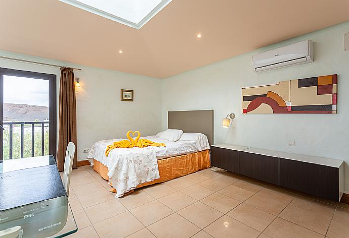 Double bedroom with A/C, desk, TV, and upper terrace access . - Villa Longa . (Photo Gallery) }}