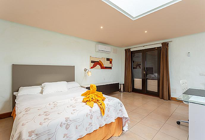 Double bedroom with A/C, desk, TV, and upper terrace access . - Villa Longa . (Photo Gallery) }}