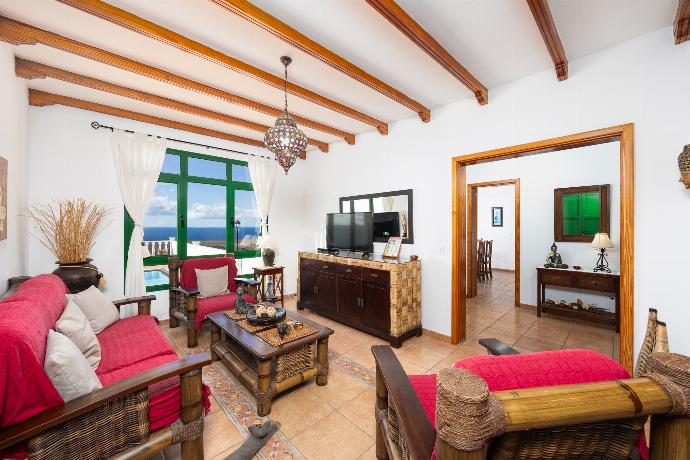 Living room with sofa, dining area, WiFi internet, satellite TV, and sea views . - Villa Sol y Mar . (Photo Gallery) }}